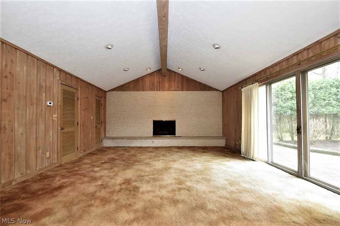 753 Esther Road Cleveland, OH 44143 - Photo 11 of 31 Family Room has vaulted ceilings and fireplace, plus slider to brick patio and yard.