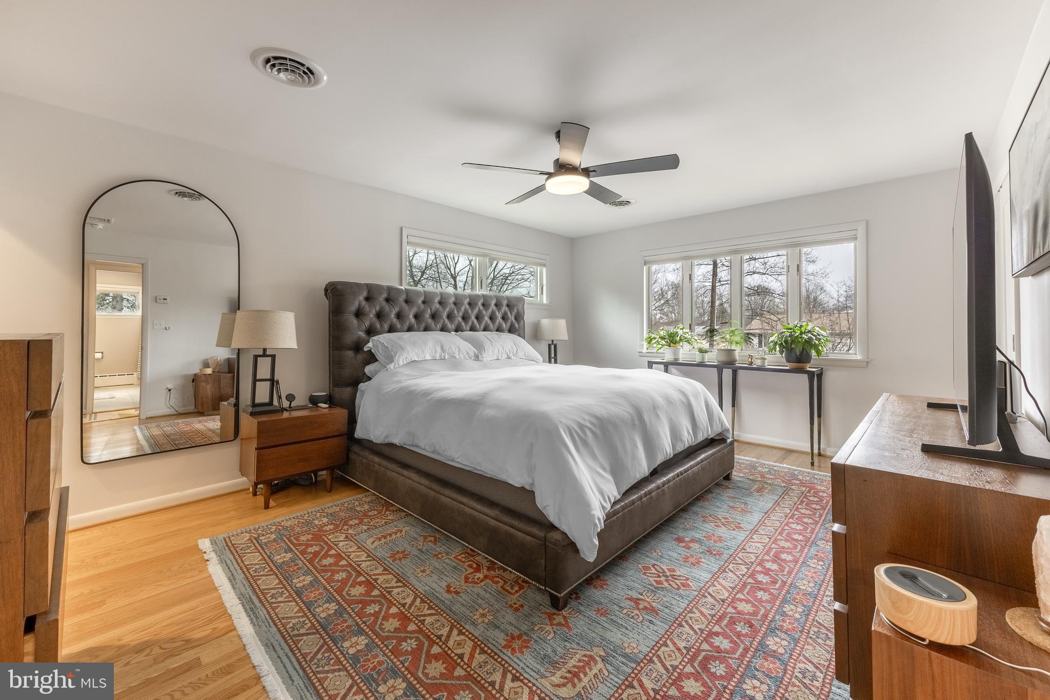 1137 Dorum Avenue State College, PA 16801 - Photo 21 of 56 a bedroom with a large bed a flat screen tv and a couch