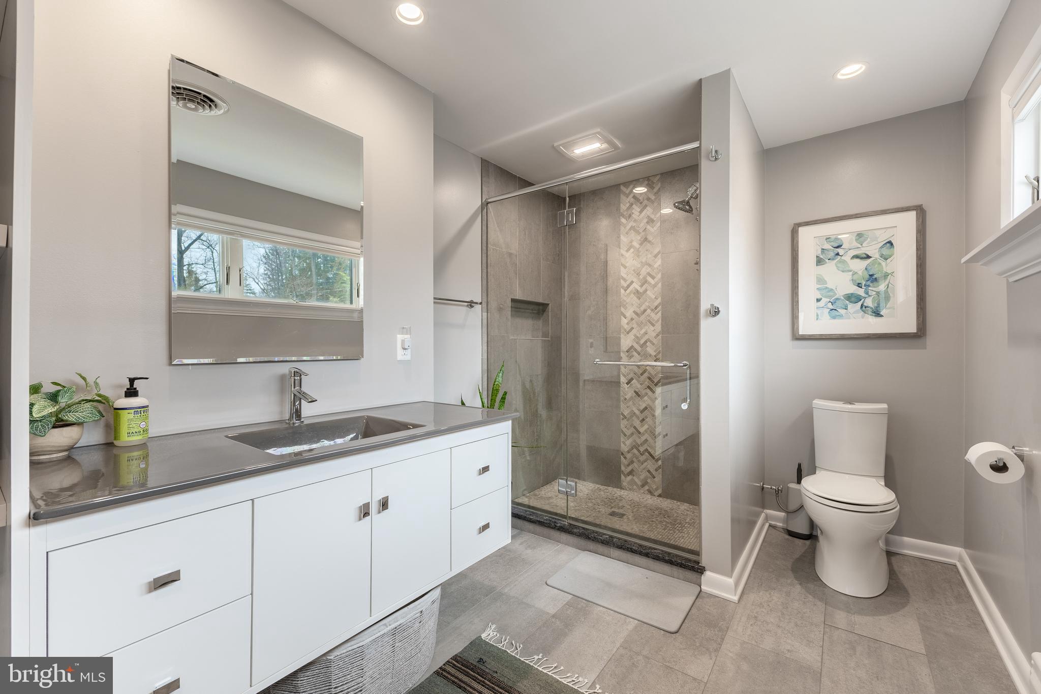 1137 Dorum Avenue State College, PA 16801 - Photo 25 of 56 a spacious bathroom with a granite countertop sink toilet and shower