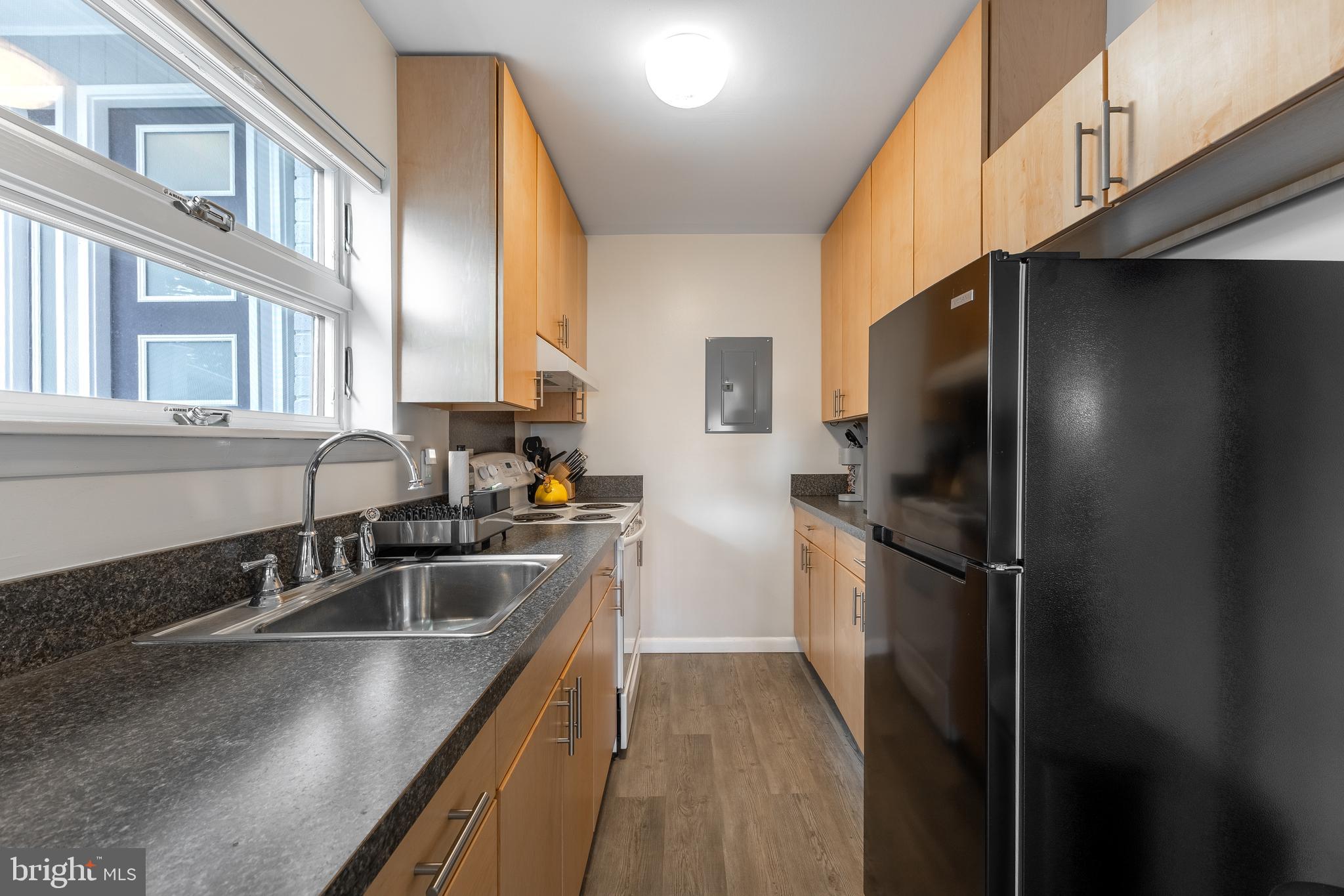 1137 Dorum Avenue State College, PA 16801 - Photo 45 of 56 a kitchen with stainless steel appliances granite countertop a sink stove and refrigerator
