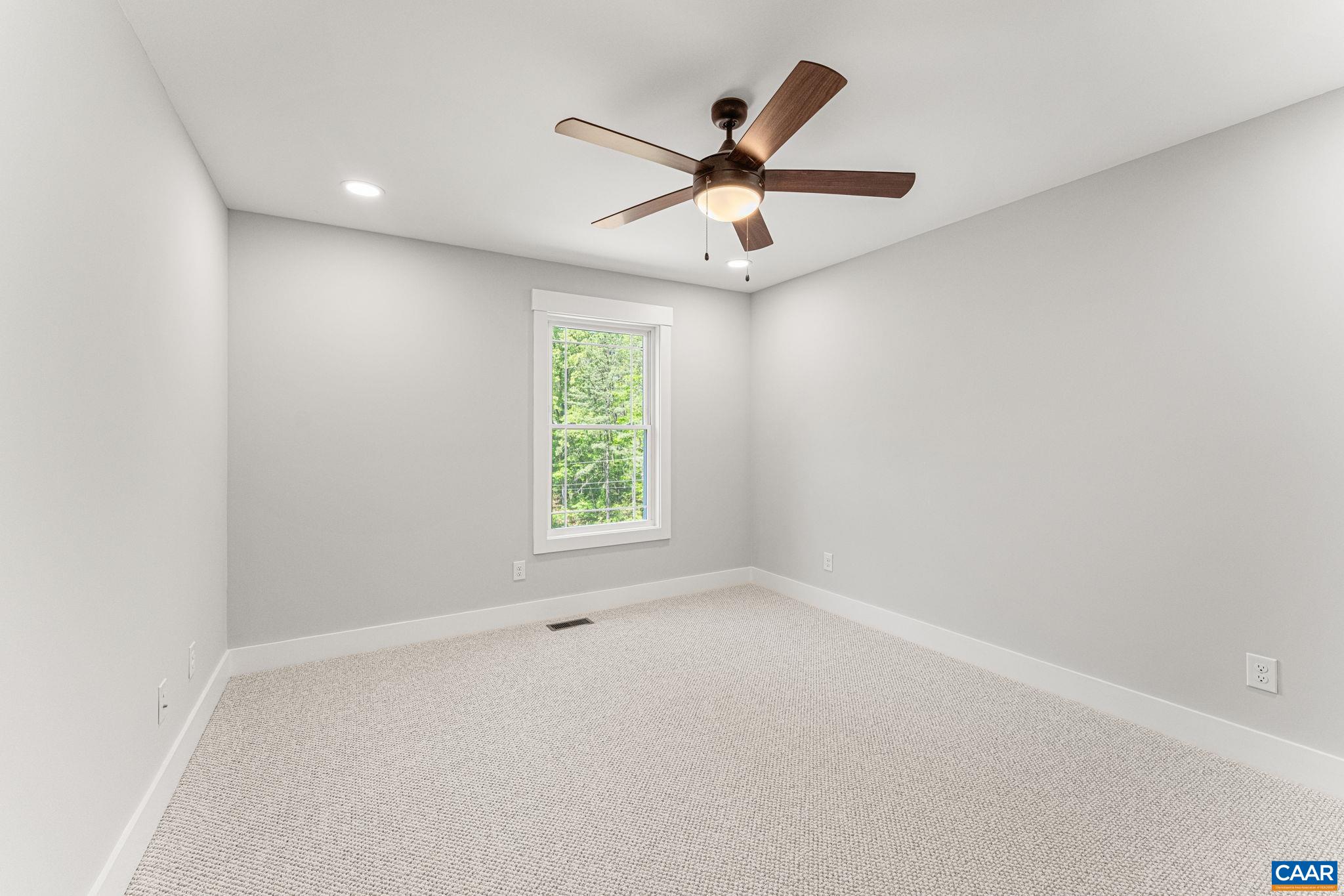 230 Fox Hollow Road Ruckersville, VA 22968 - Photo 31 of 42 an empty room with a window and a fan