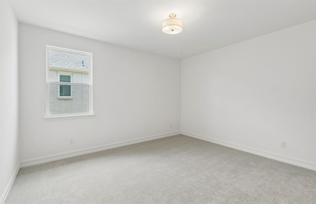 11220 Abbotsbury Road Fort Worth, TX 76052 - Photo 21 of 32 an empty room with a window
