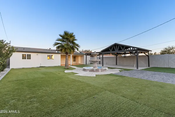 a view of a house with a yard and garage