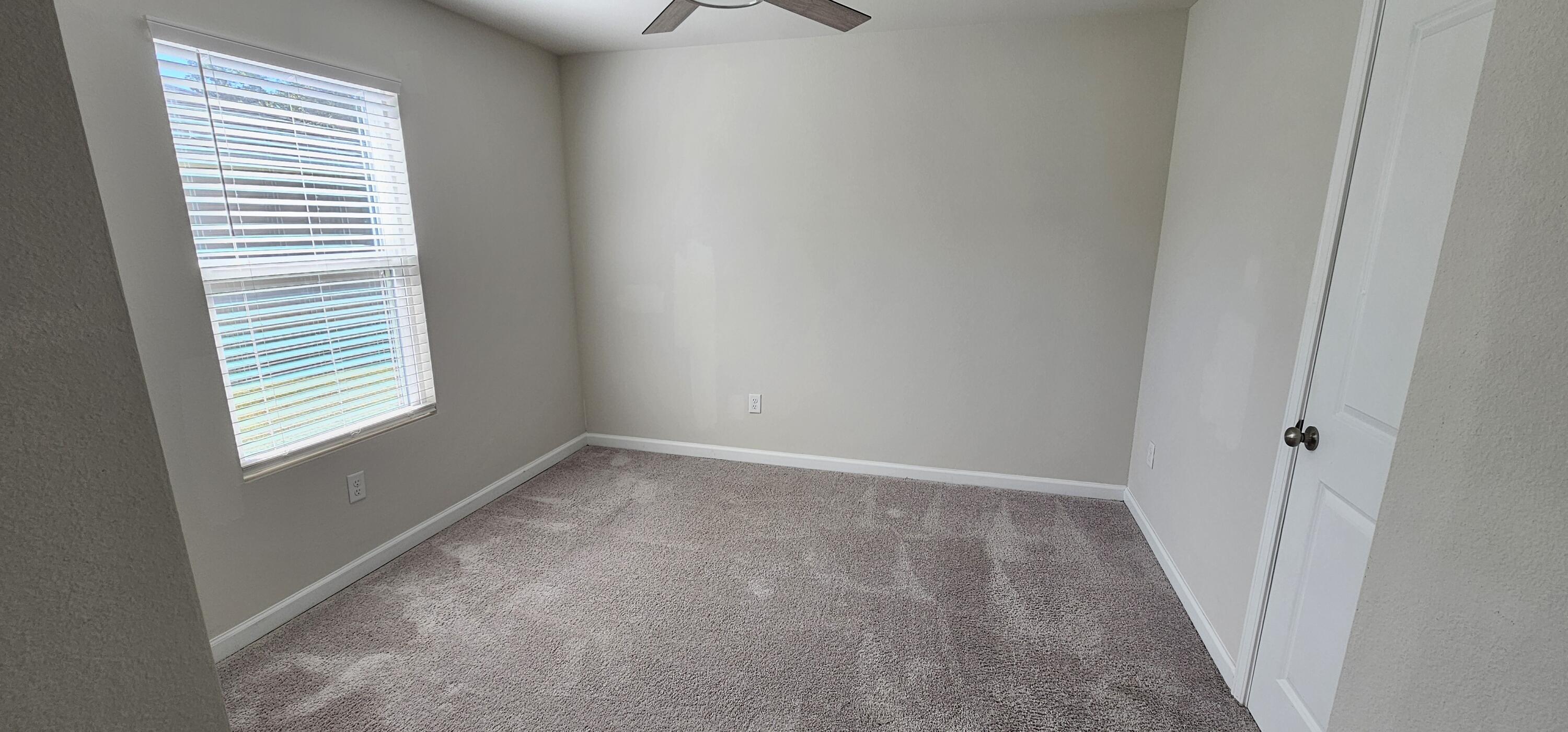 460 Riverwalk Circle Freeport, FL 32439 - Photo 16 of 25 a view of an empty room with a window
