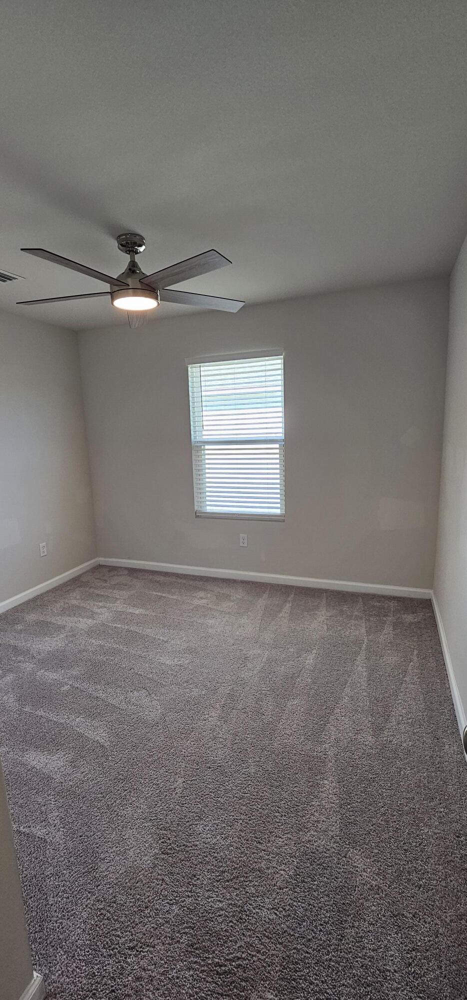 460 Riverwalk Circle Freeport, FL 32439 - Photo 17 of 25 a view of a room that has a window in it