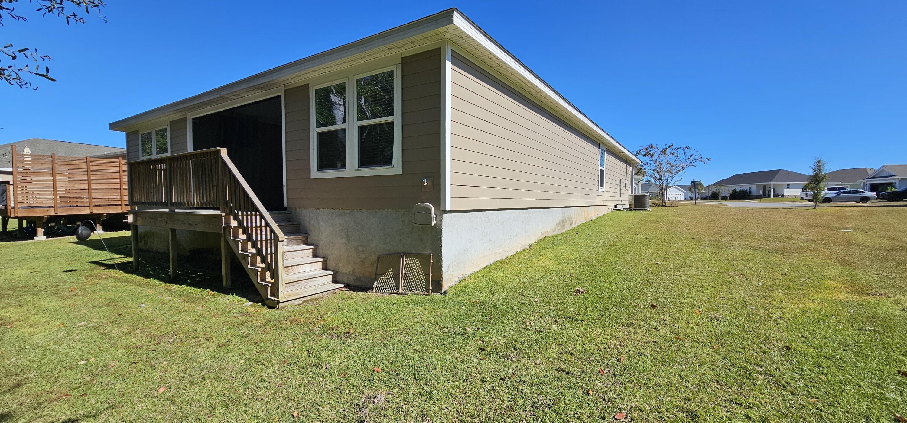 460 Riverwalk Circle Freeport, FL 32439 - Photo 24 of 25 a view of a backyard of the house
