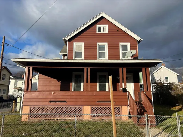 a front view of a house with a balcony