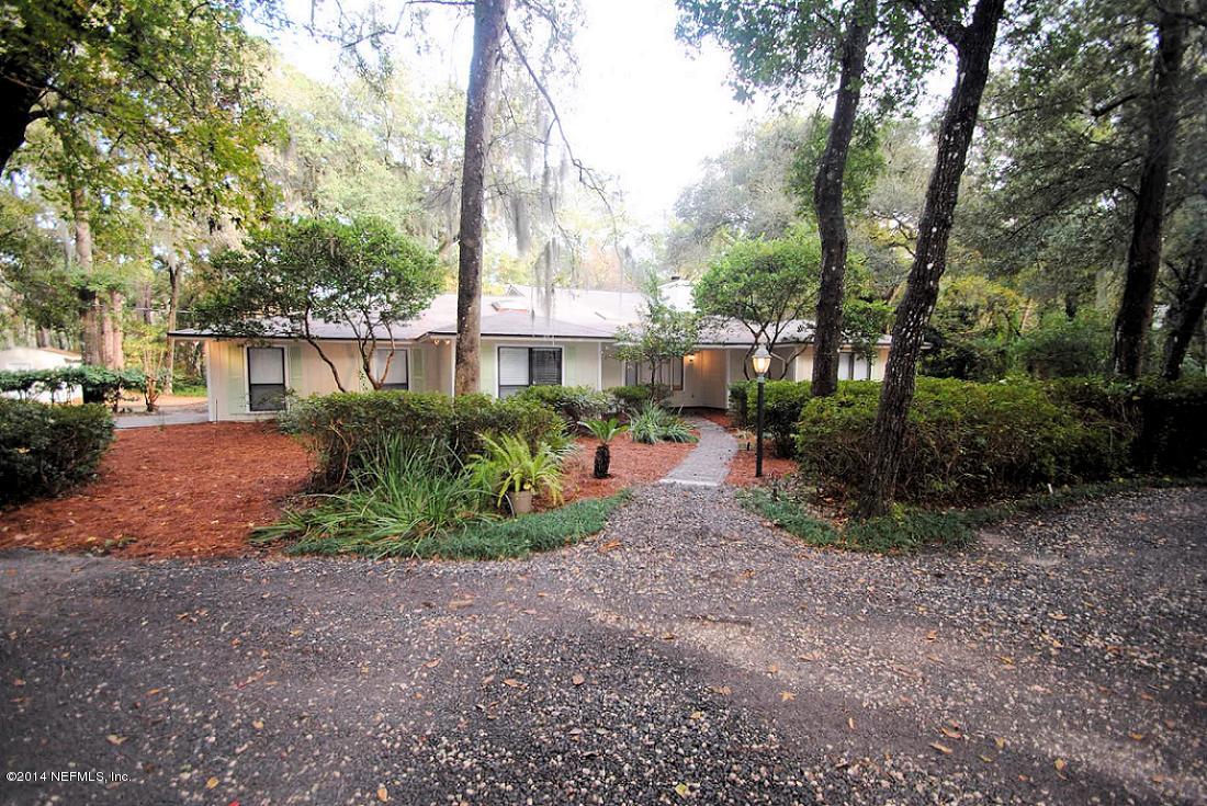 11331 Scott Mill Road Jacksonville, FL 32223 - Photo 1 of 19 a view of a park that has large trees and a parked car