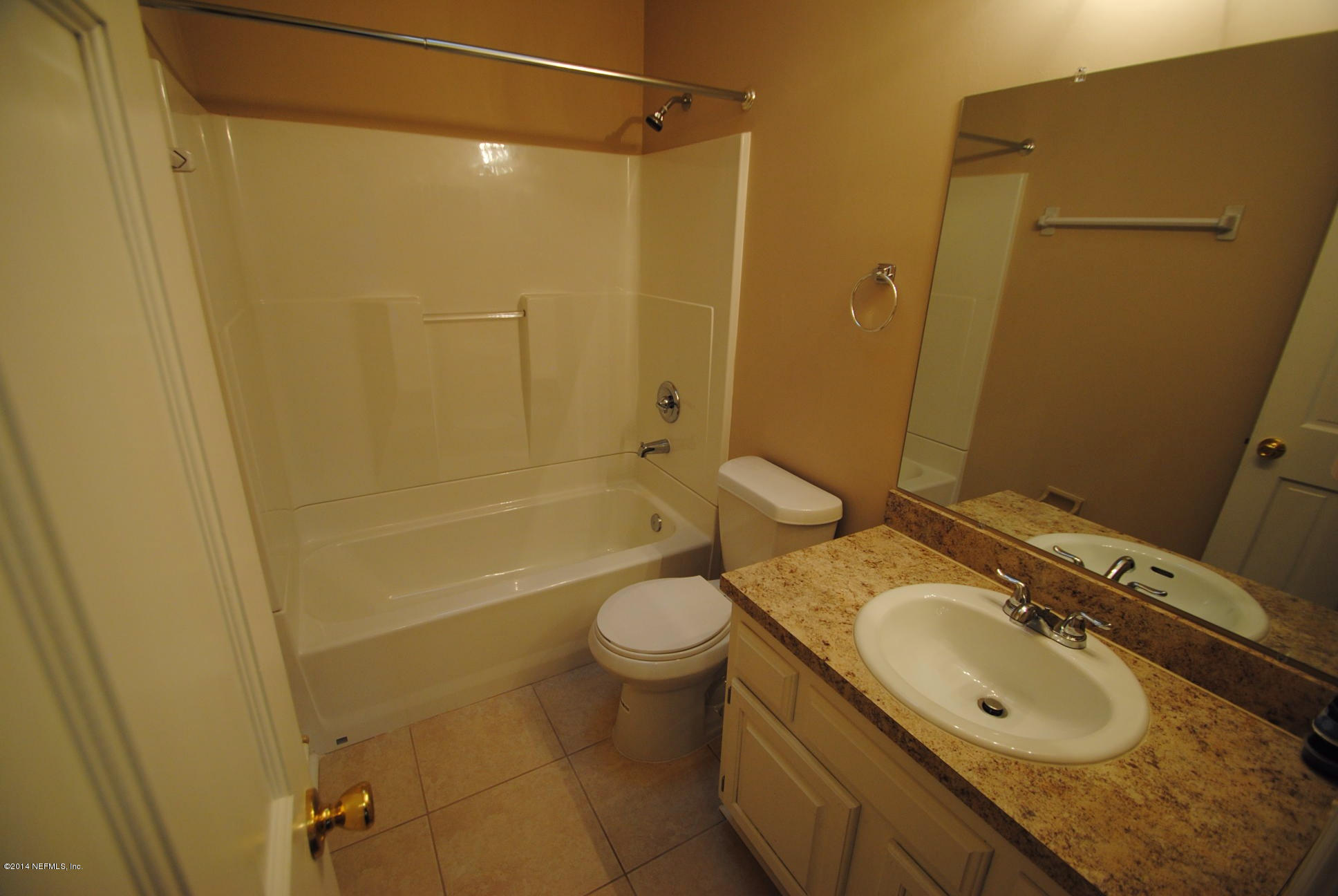 11331 Scott Mill Road Jacksonville, FL 32223 - Photo 15 of 19 a bathroom with a granite countertop toilet sink and shower