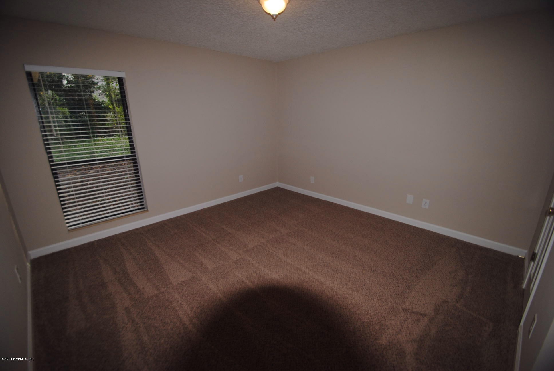 11331 Scott Mill Road Jacksonville, FL 32223 - Photo 16 of 19 a view of an empty room with a window
