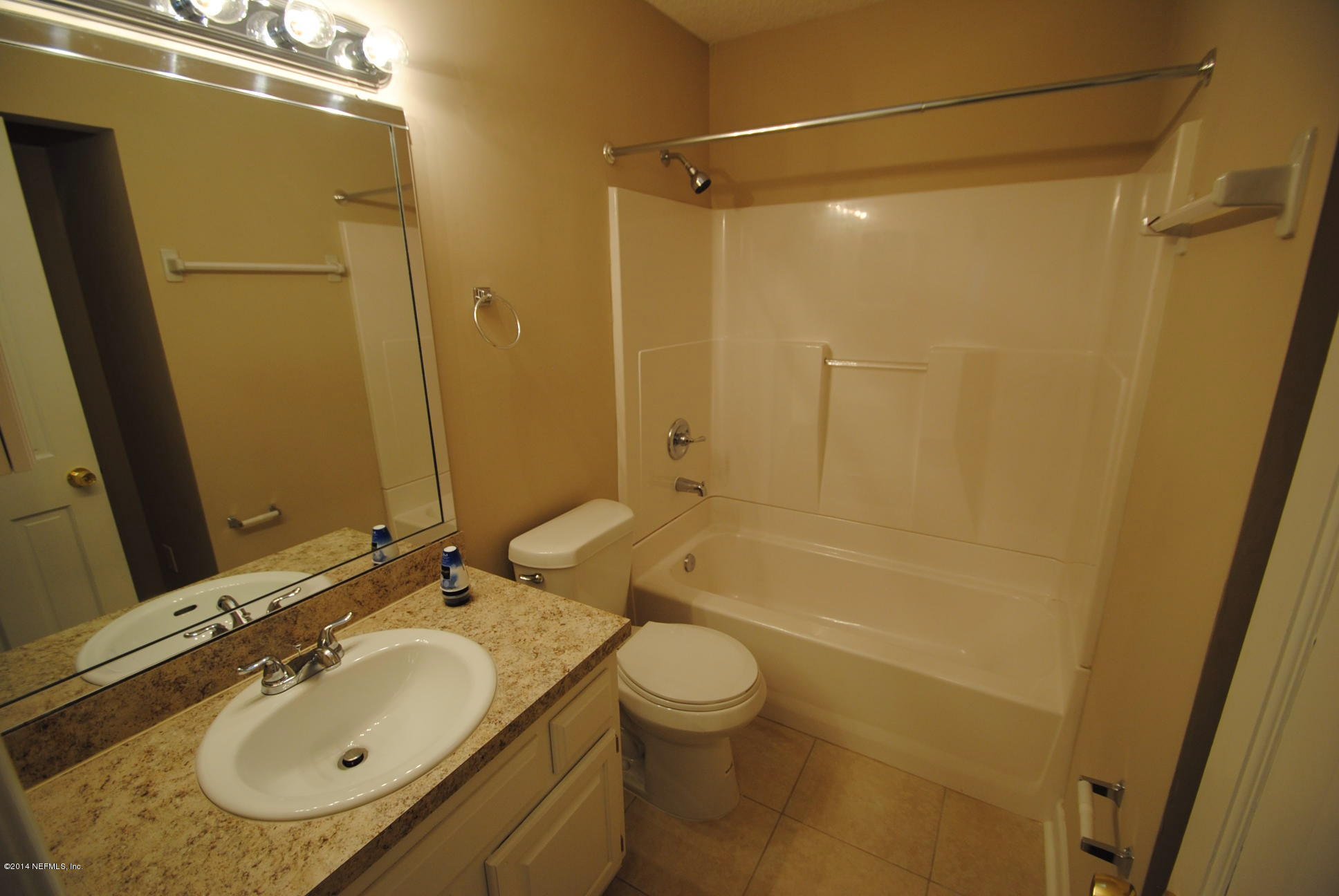 11331 Scott Mill Road Jacksonville, FL 32223 - Photo 17 of 19 a bathroom with a granite countertop sink toilet and shower