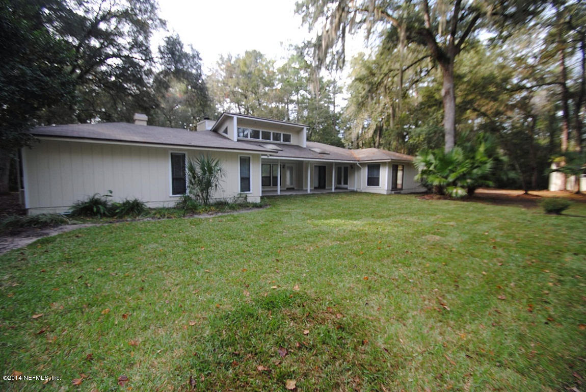 11331 Scott Mill Road Jacksonville, FL 32223 - Photo 2 of 19 a view of a house with a yard and sitting area