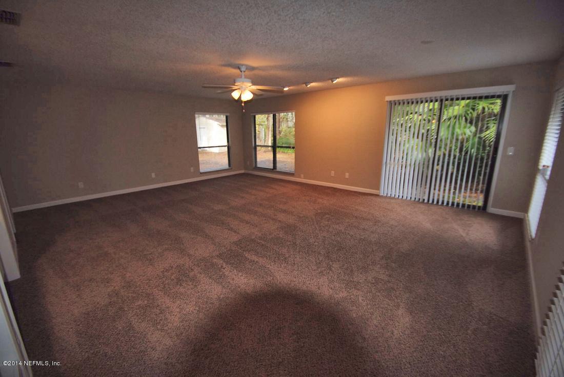 11331 Scott Mill Road Jacksonville, FL 32223 - Photo 4 of 19 a view of an empty room with a window