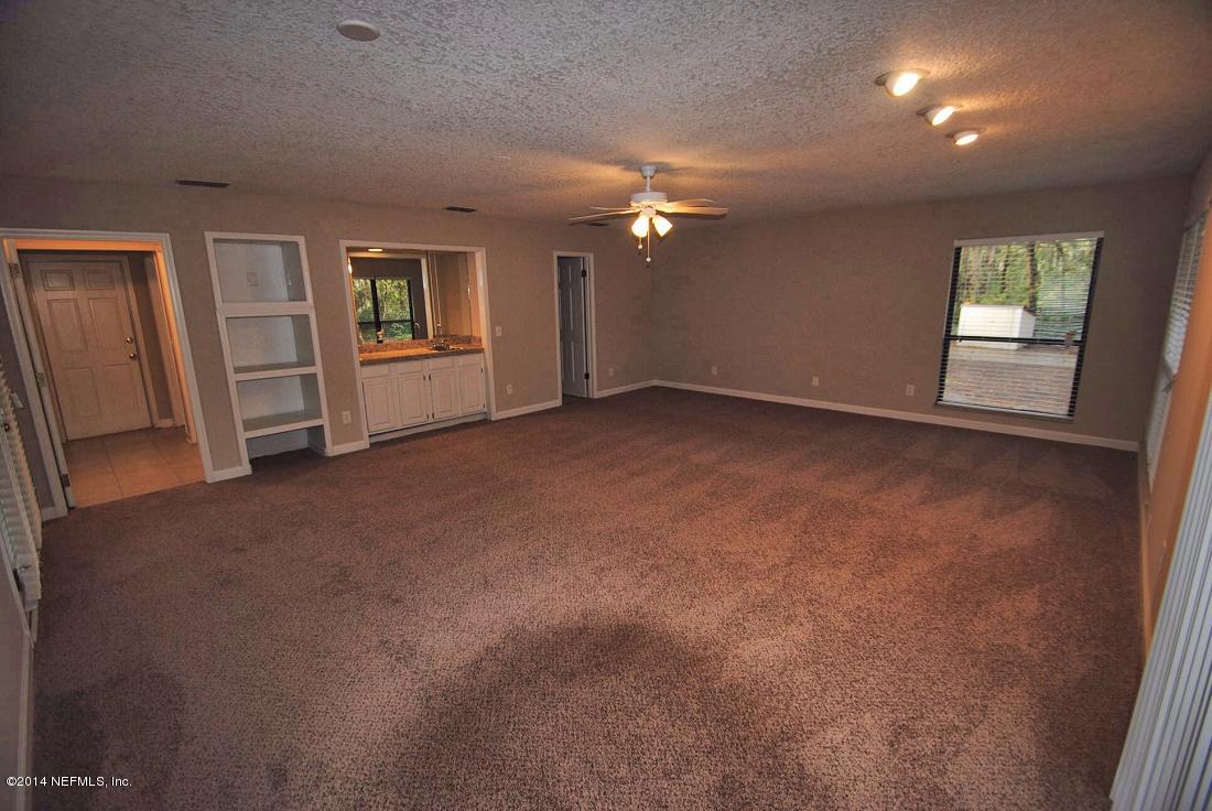 11331 Scott Mill Road Jacksonville, FL 32223 - Photo 5 of 19 an empty room with windows