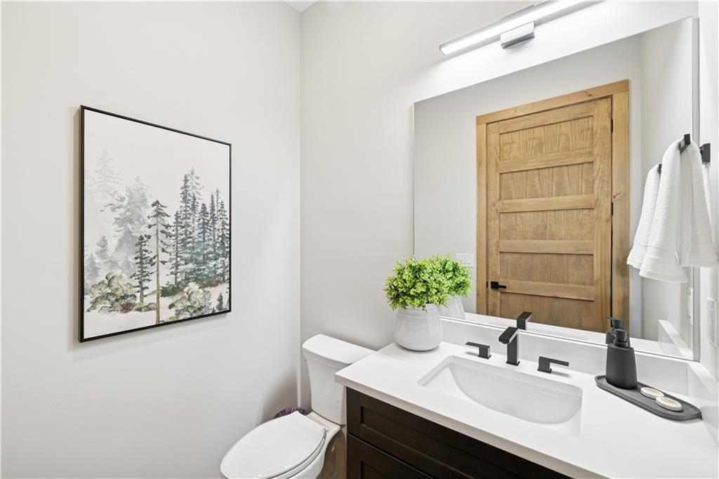 714 Scouts Overlook Lane Morganton, GA 30560 - Photo 11 of 48 a bathroom with a sink toilet and vanity