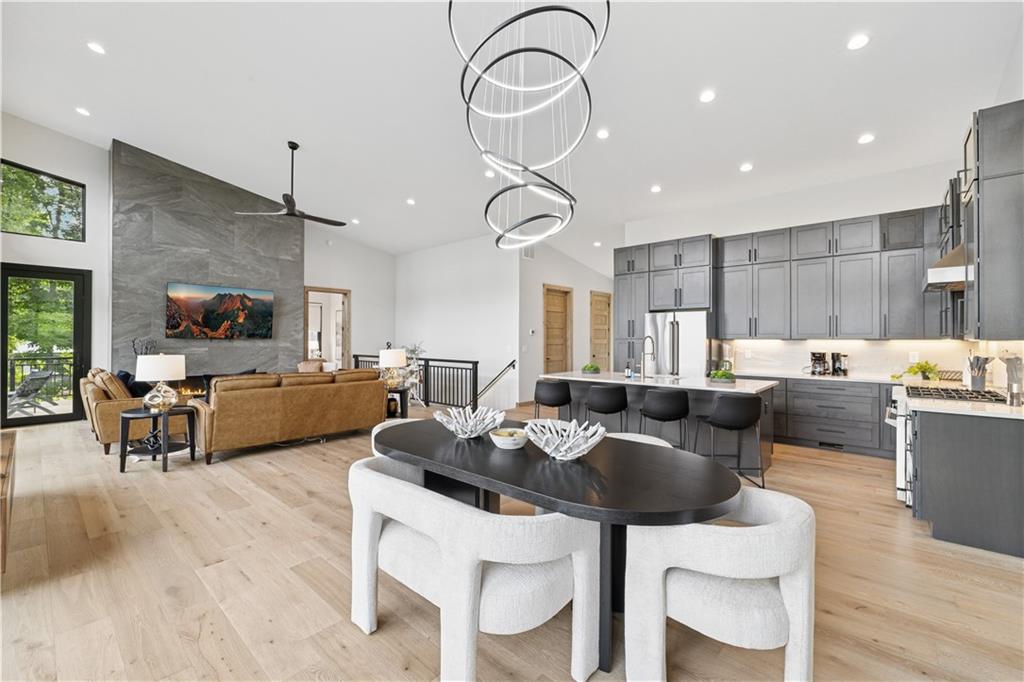 714 Scouts Overlook Lane Morganton, GA 30560 - Photo 12 of 48 a living room with furniture kitchen view and a chandelier