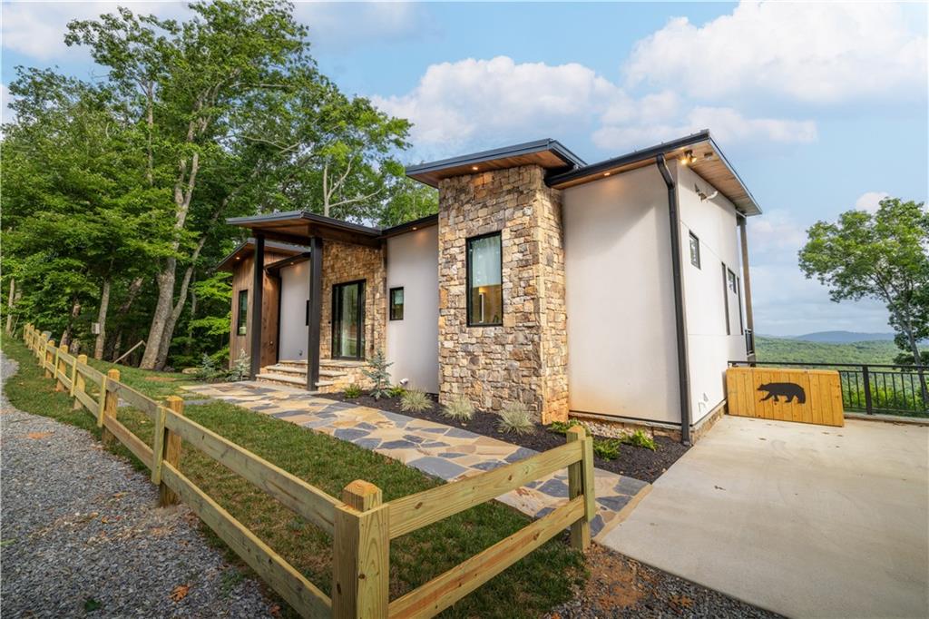 714 Scouts Overlook Lane Morganton, GA 30560 - Photo 2 of 48 a front view of a house with garden