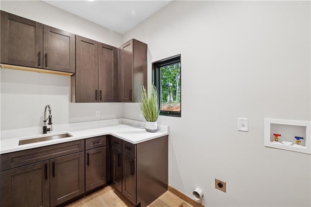 714 Scouts Overlook Lane Morganton, GA 30560 - Photo 25 of 48 a kitchen with a sink cabinets and window