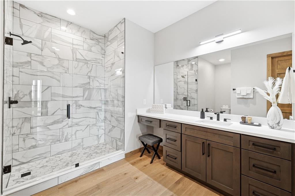 714 Scouts Overlook Lane Morganton, GA 30560 - Photo 28 of 48 a bathroom with a double vanity sink mirror and shower