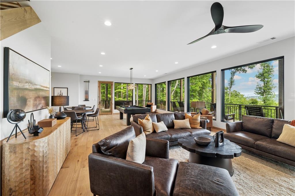 714 Scouts Overlook Lane Morganton, GA 30560 - Photo 31 of 48 a living room with furniture and a large window