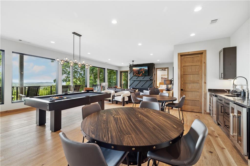714 Scouts Overlook Lane Morganton, GA 30560 - Photo 33 of 48 a living room with furniture a large window and wooden floor