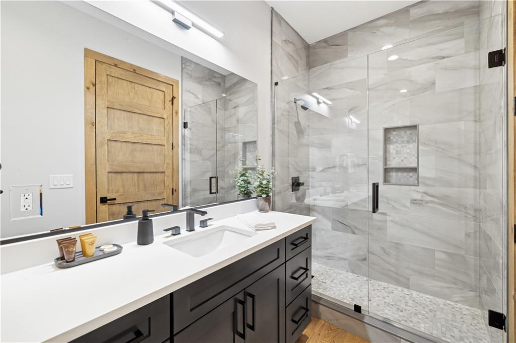 714 Scouts Overlook Lane Morganton, GA 30560 - Photo 35 of 48 a bathroom with a sink double vanity and a mirror