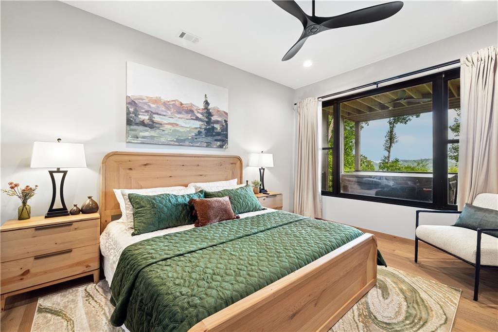 714 Scouts Overlook Lane Morganton, GA 30560 - Photo 37 of 48 a bedroom with a large bed and a balcony view