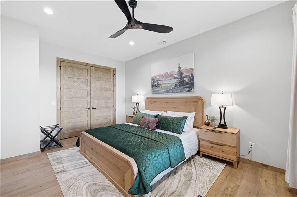 714 Scouts Overlook Lane Morganton, GA 30560 - Photo 38 of 48 a bedroom with a bed and wooden floor