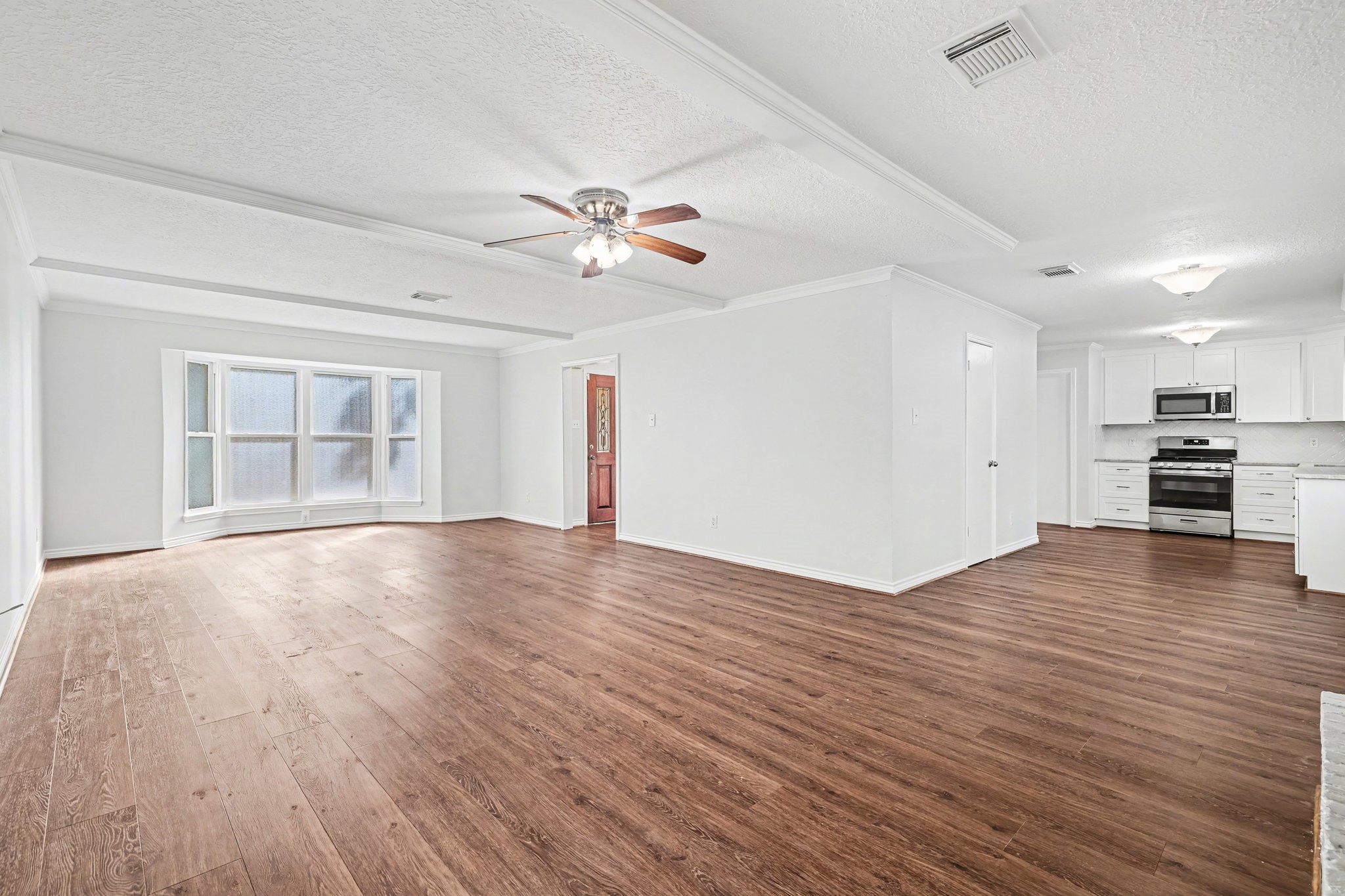 6910 Chancellor Drive Spring, TX 77379 - Photo 40 of 41 a view of empty room with wooden floor and fan