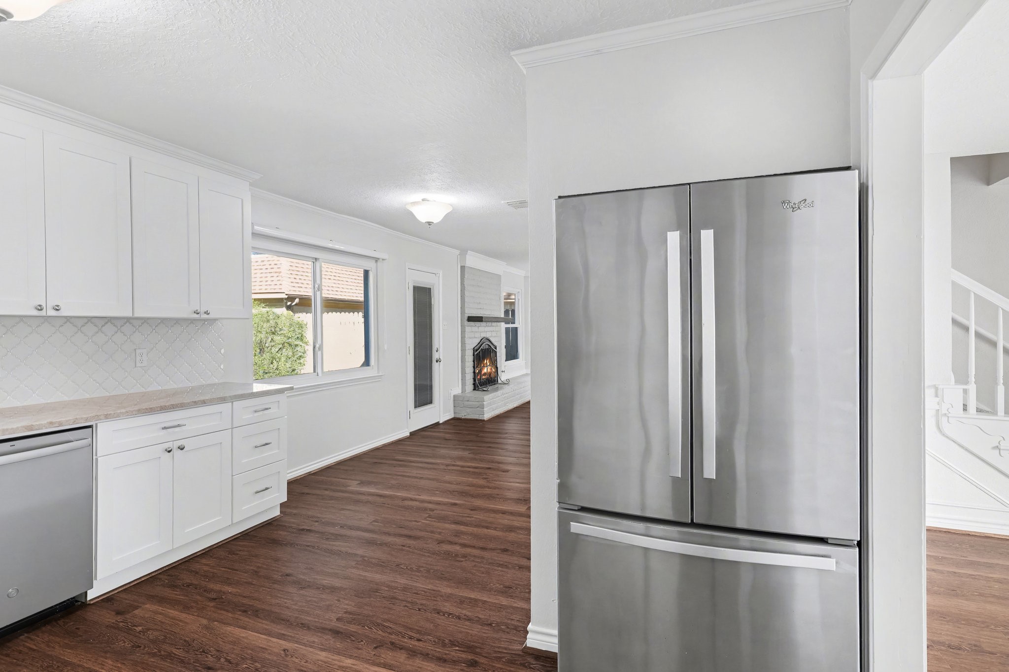 6910 Chancellor Drive Spring, TX 77379 - Photo 15 of 41 a kitchen with stainless steel appliances granite countertop a refrigerator and a sink