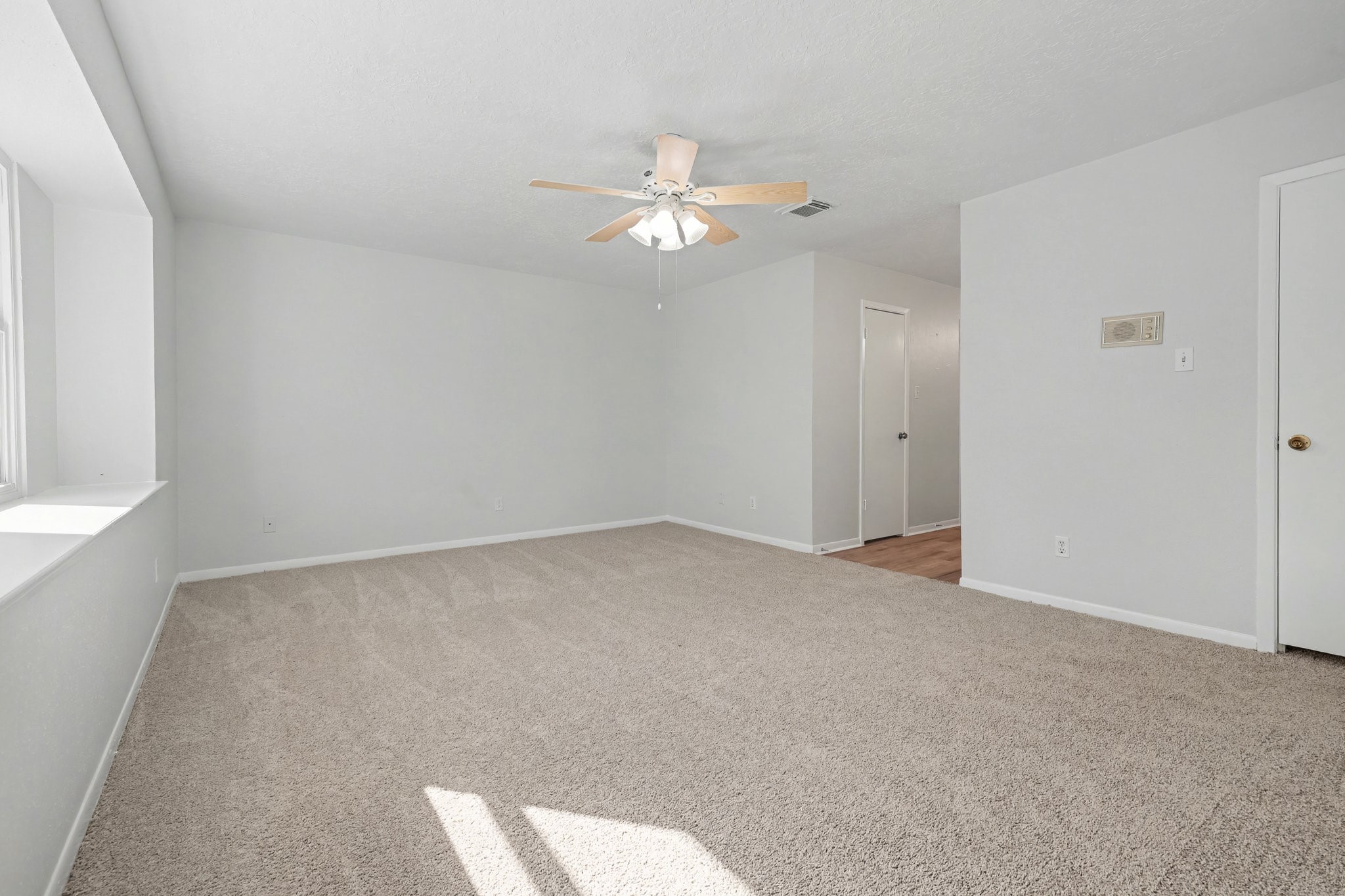 6910 Chancellor Drive Spring, TX 77379 - Photo 20 of 41 an empty room with closet and a chandelier fan