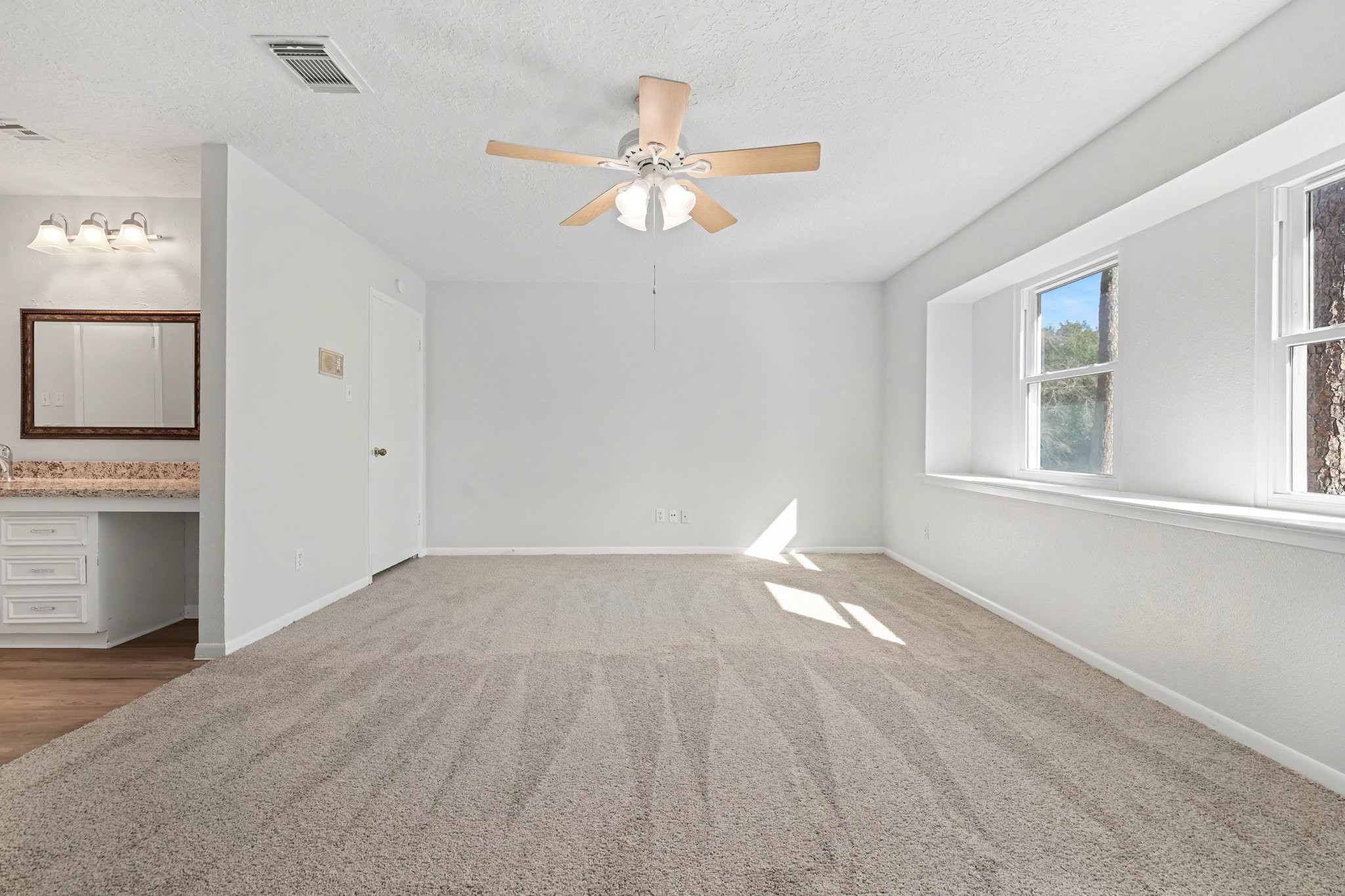 6910 Chancellor Drive Spring, TX 77379 - Photo 21 of 41 wooden floor in an empty room with a window