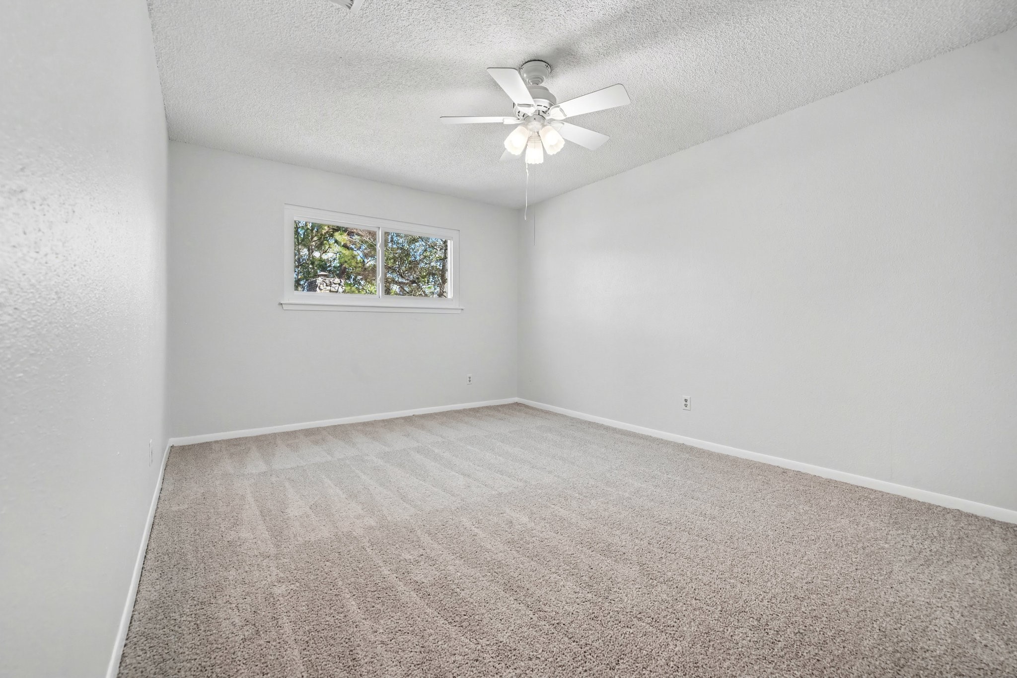 6910 Chancellor Drive Spring, TX 77379 - Photo 27 of 41 an empty room with a window