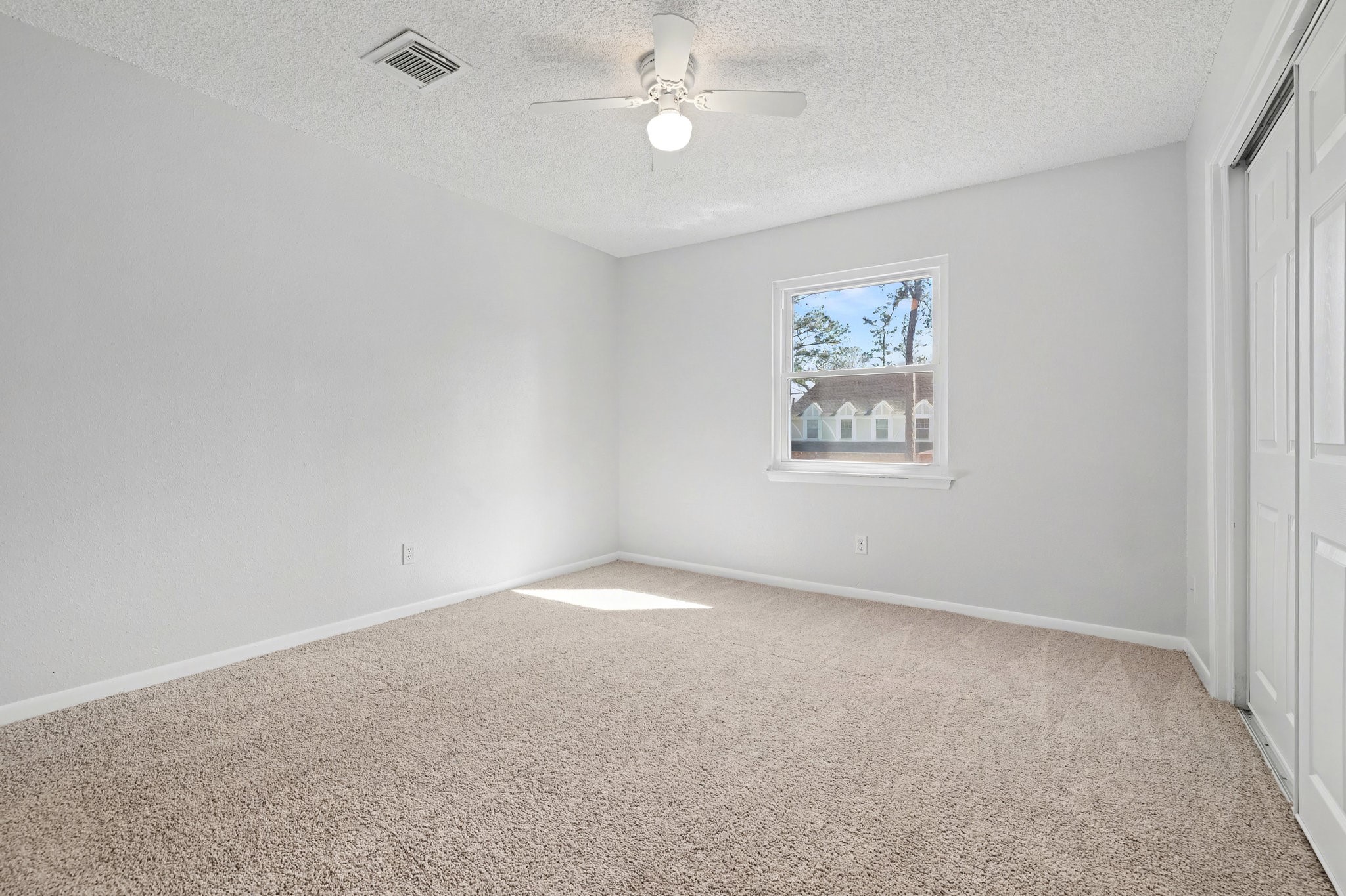 6910 Chancellor Drive Spring, TX 77379 - Photo 29 of 41 an empty room with a window