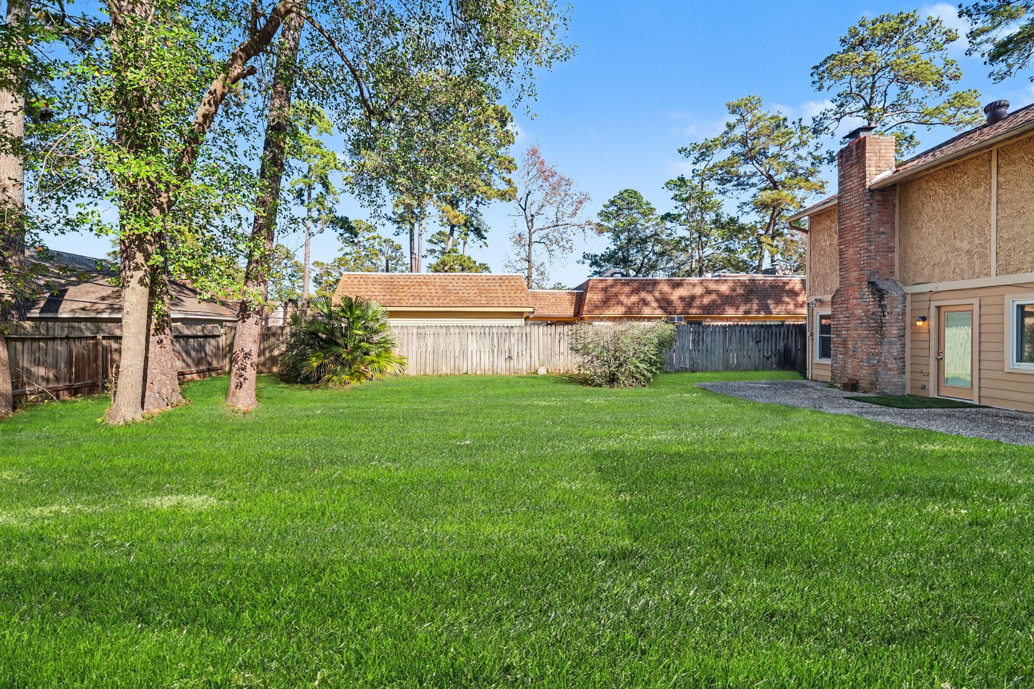 6910 Chancellor Drive Spring, TX 77379 - Photo 37 of 41 a view of house with backyard and garden