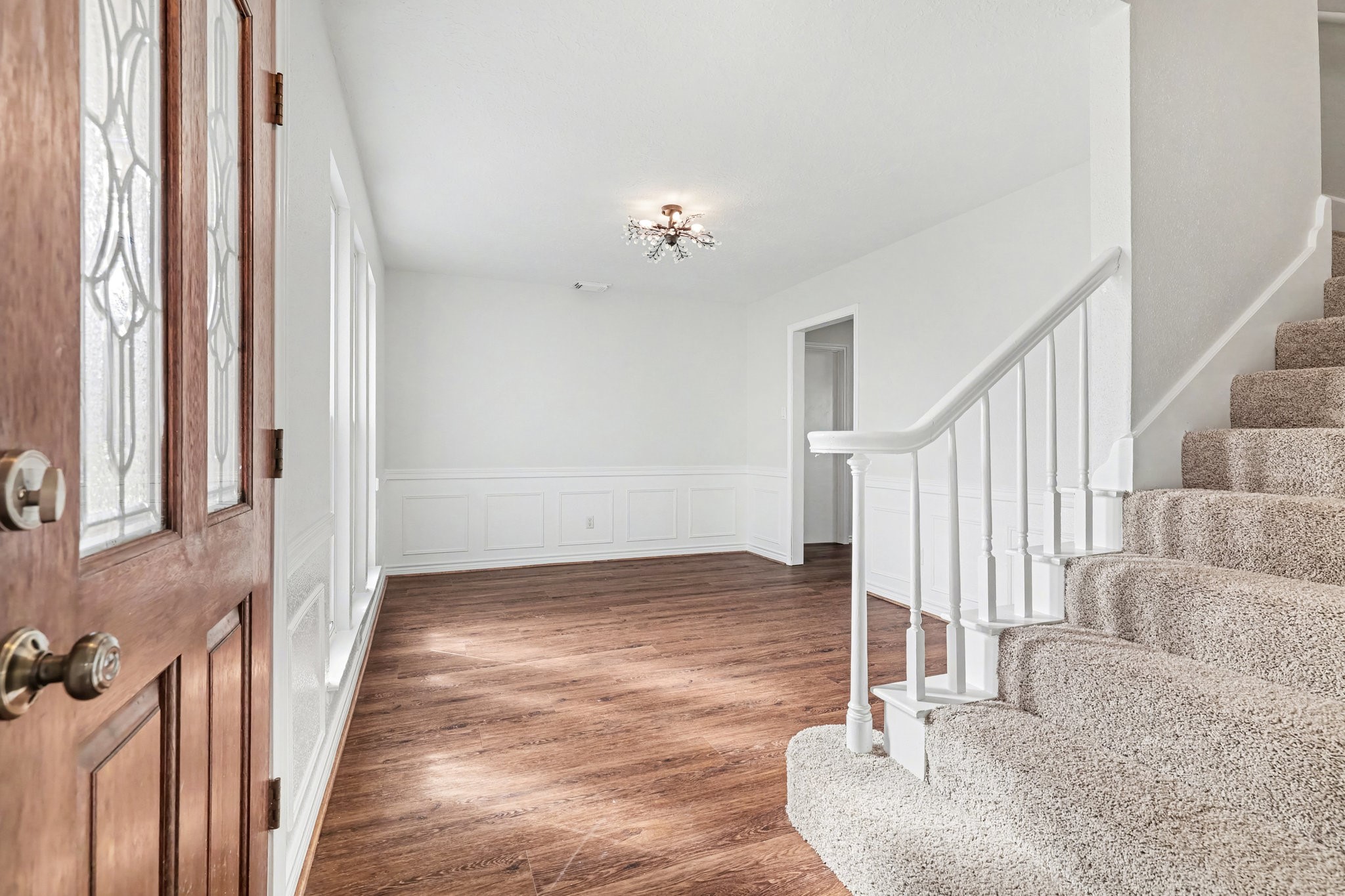 6910 Chancellor Drive Spring, TX 77379 - Photo 5 of 41 a view of entryway and hall with wooden floor