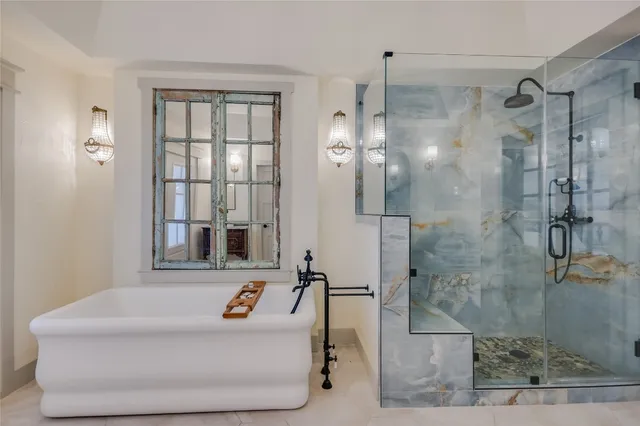 a bathroom with a sink a mirror and shower