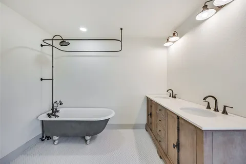 a bathroom with a double vanity sink and a mirror