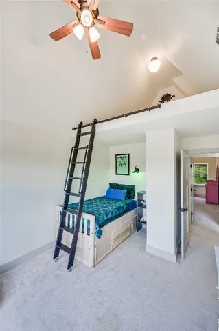 a bedroom with furniture and window