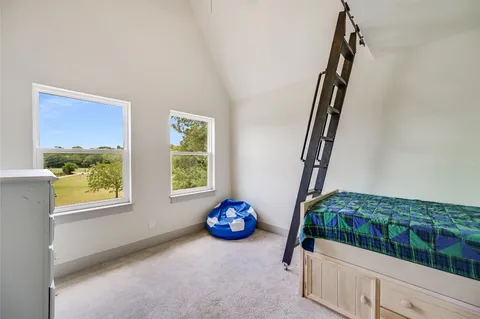 a view of front door and bedroom with windows