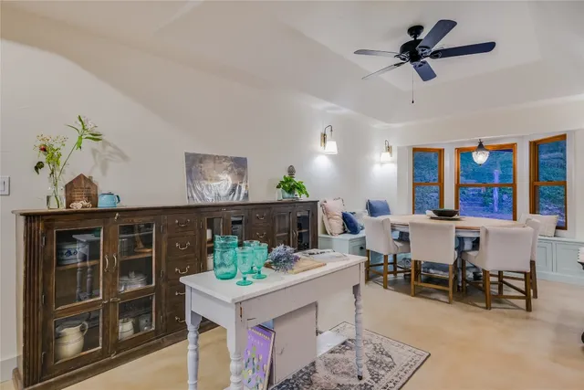 a view of a workspace with furniture