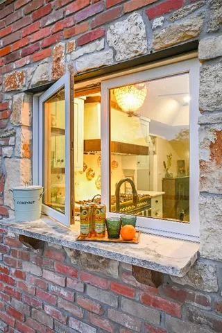 a view of a living room with a large window