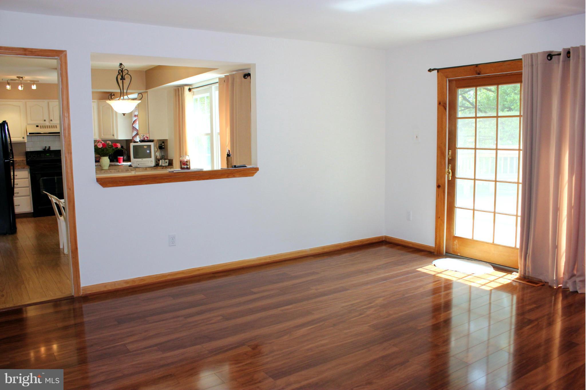8707 Crystal Rock Lane Laurel, MD 20708 - Photo 13 of 30 Family Room w/ Pass Through from Kitchen