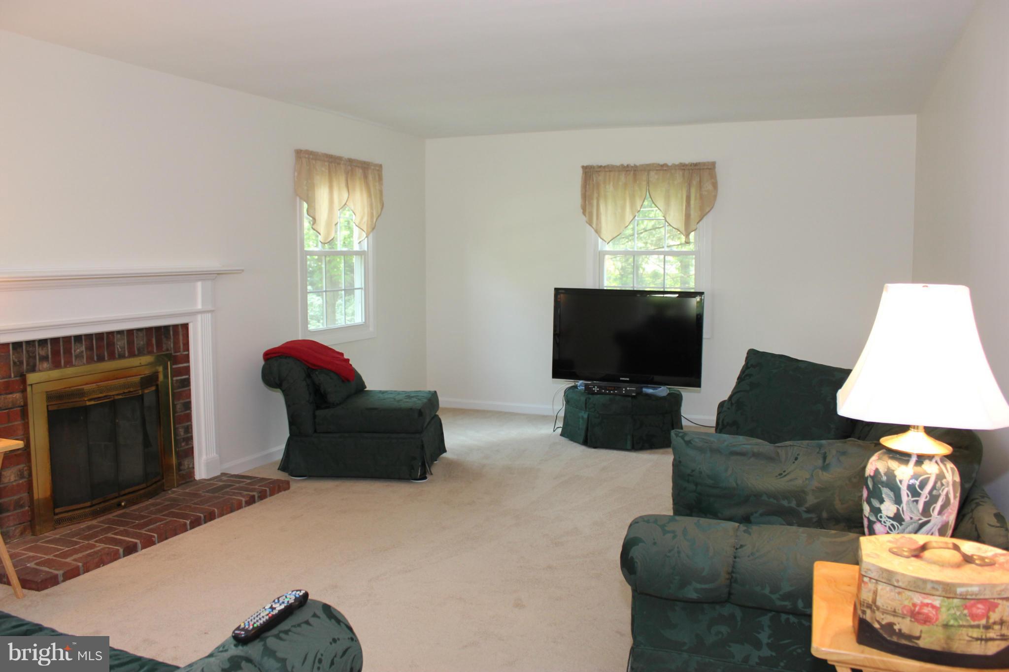 8707 Crystal Rock Lane Laurel, MD 20708 - Photo 16 of 30 Living Room w/ 2nd Wood Burning Fireplace