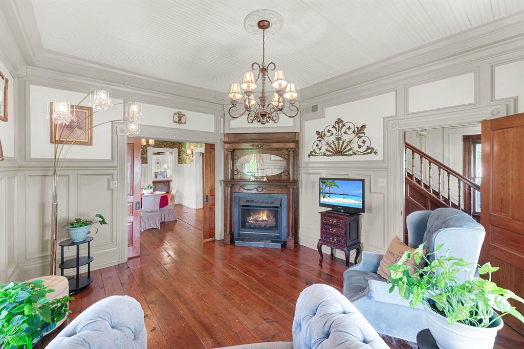 1425 Lone Star Road Celina, TX 75009 - Photo 7 of 40 Original Victorian character lives on through the carefully recreated moldings, trim, and woodwork found throughout this elegant gathering space. Everyday moments feel a little more meaningful in a room designed for slowing down and connecting.