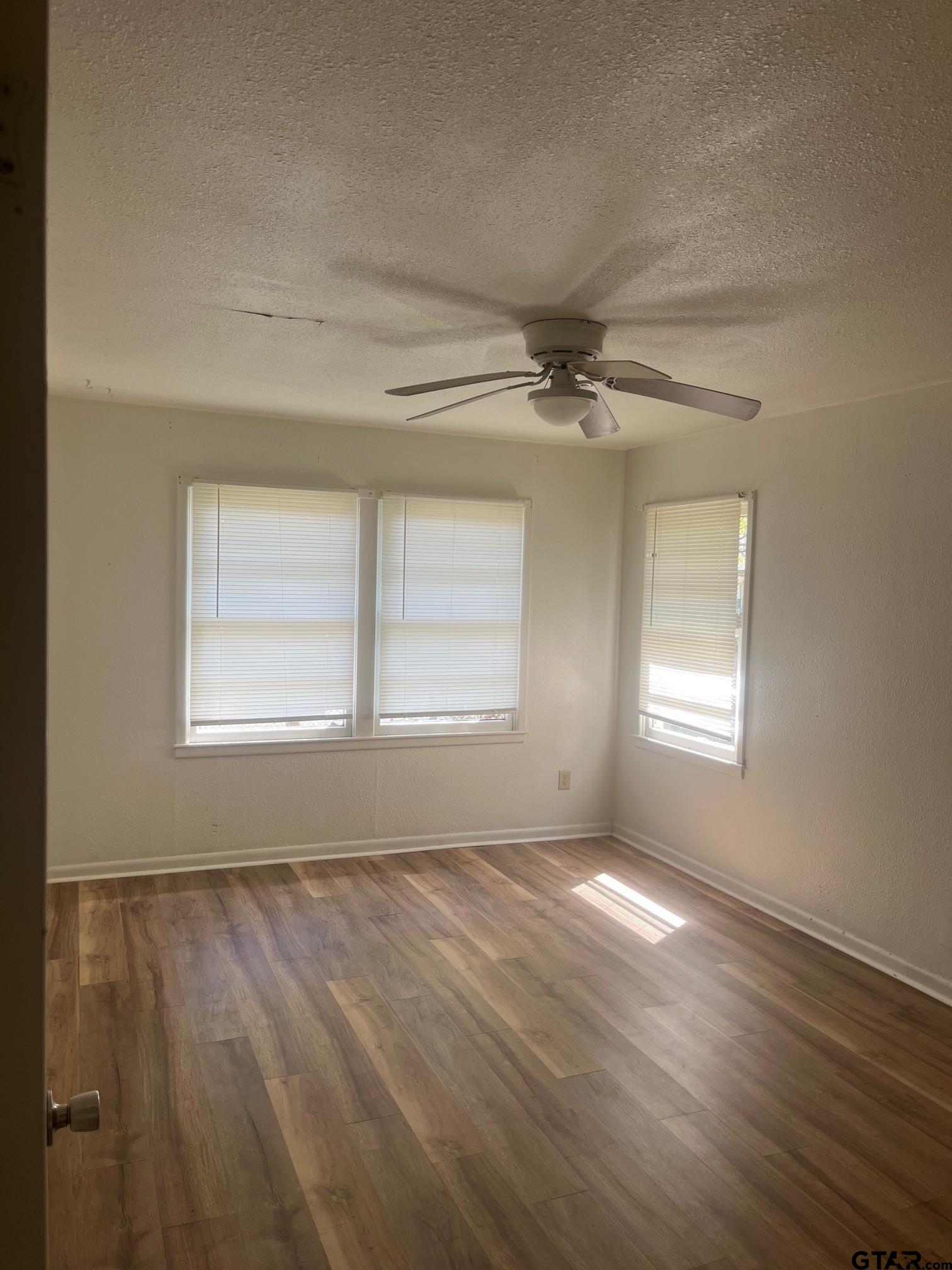 700 West 2nd Street Tyler, TX 75701 - Photo 4 of 10 a view of an empty room with a window