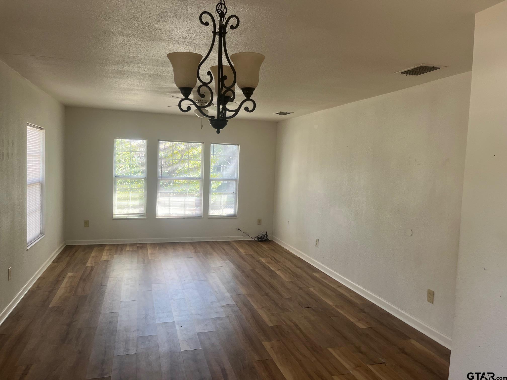 700 West 2nd Street Tyler, TX 75701 - Photo 10 of 10 a view of a room with a window and wooden floor