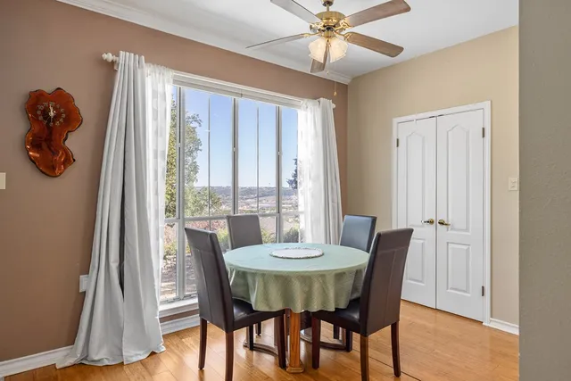 a view of a dining room with furniture window and wooden floor