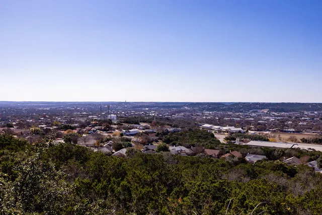 an aerial view of residential house and green space