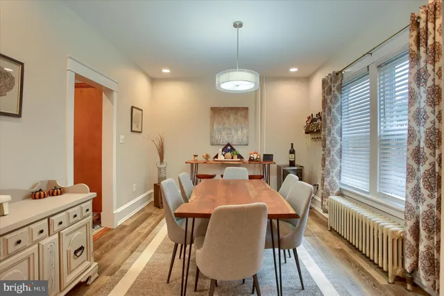 a dining room with furniture and window